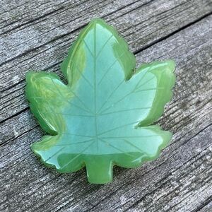 Jade maple leaf pin. 1x1.25 inches. Excellent condition.
